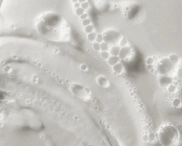 Close-up of a bubbly, white foam surface.