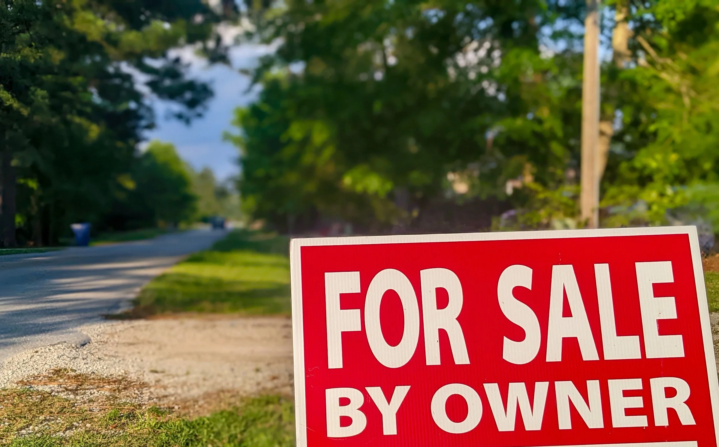 For Sale By Owner sign outside a home