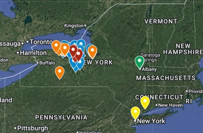 Map showing various colored pins across New York, surrounding states, and parts of Canada and New England.