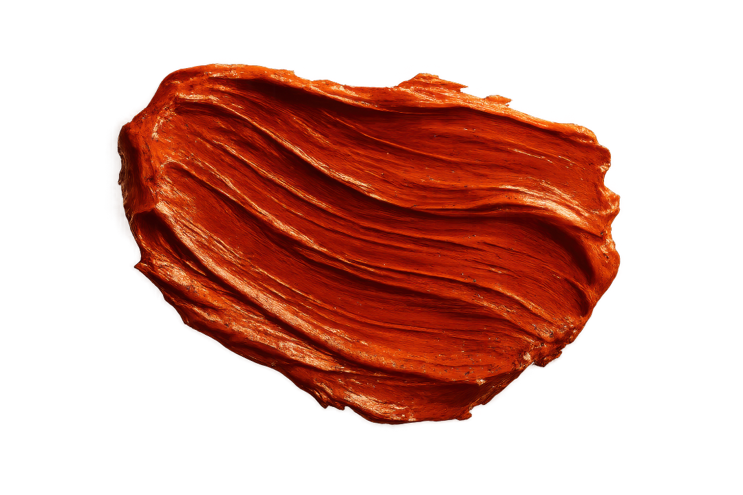 Close-up of a piece of beef jerky with a textured surface and reddish-brown color against a black and red background.