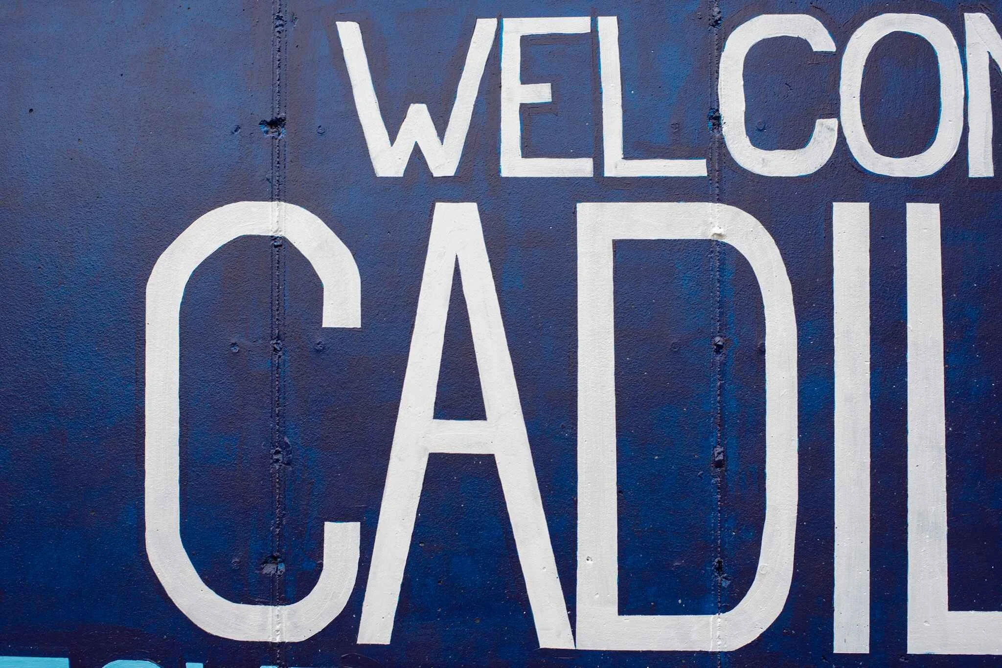 Cadillac, Michigan, welcome sign mural closeup.
