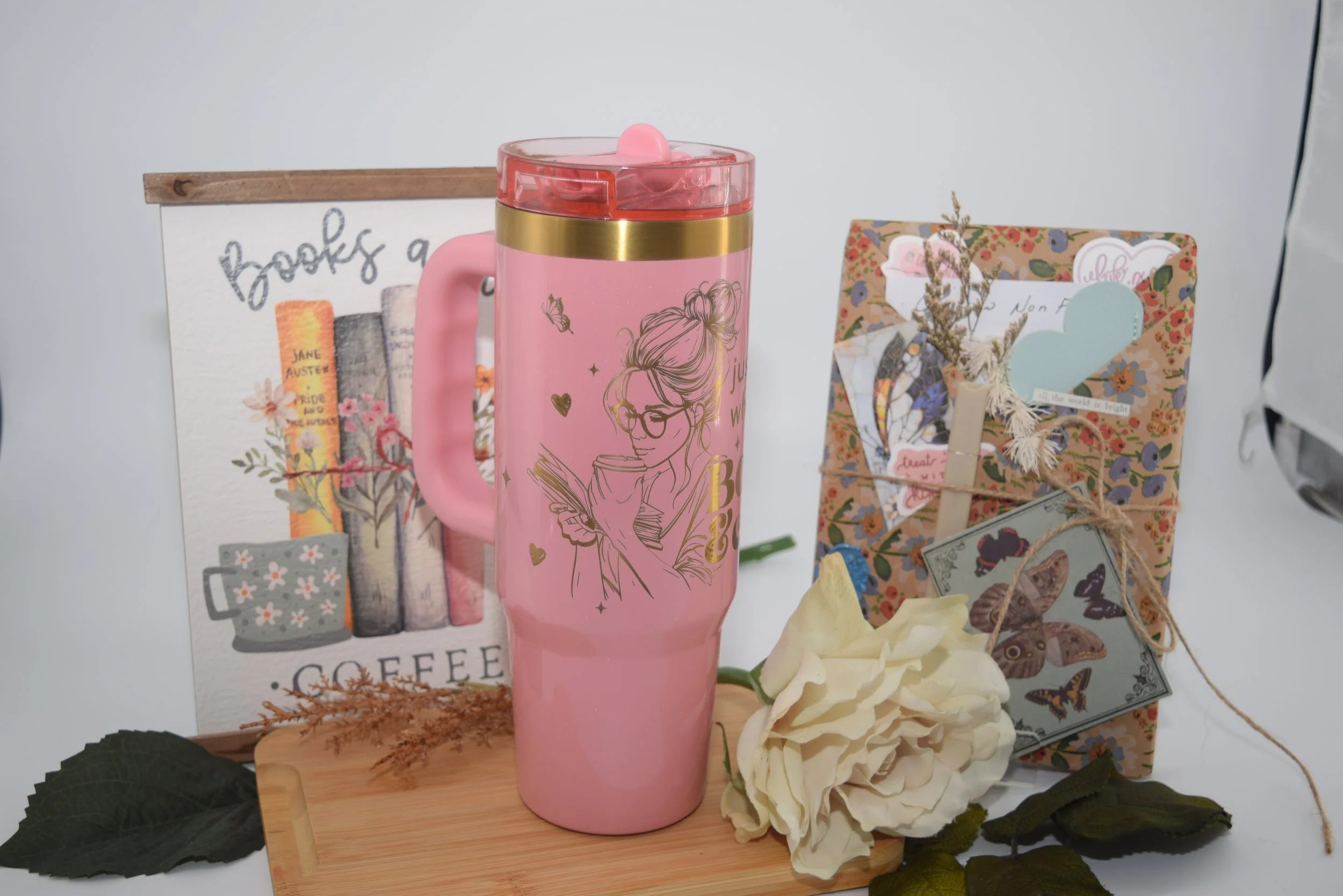 girl face books & coffee tumbler.JPG