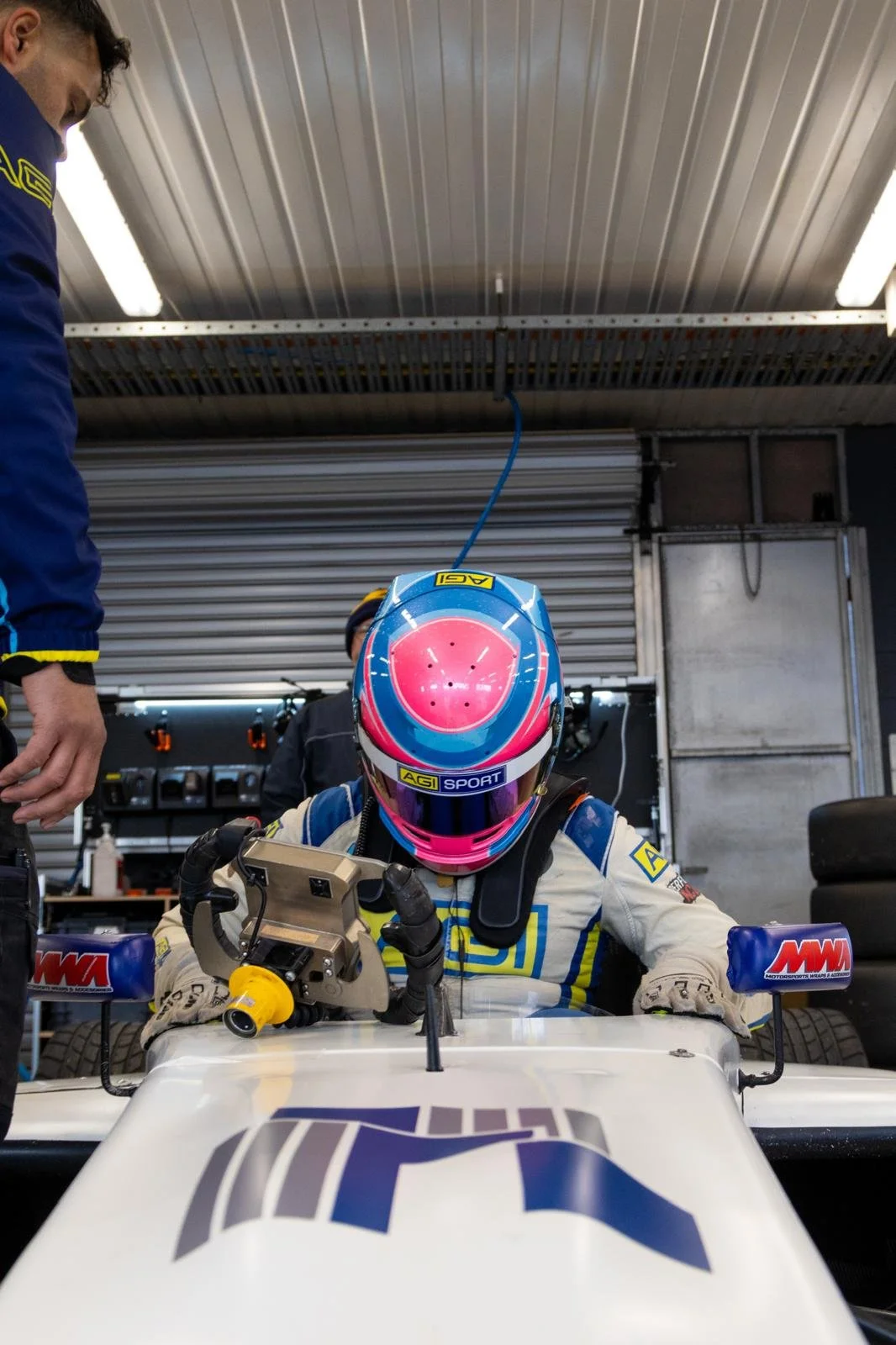 F4 racer entering car