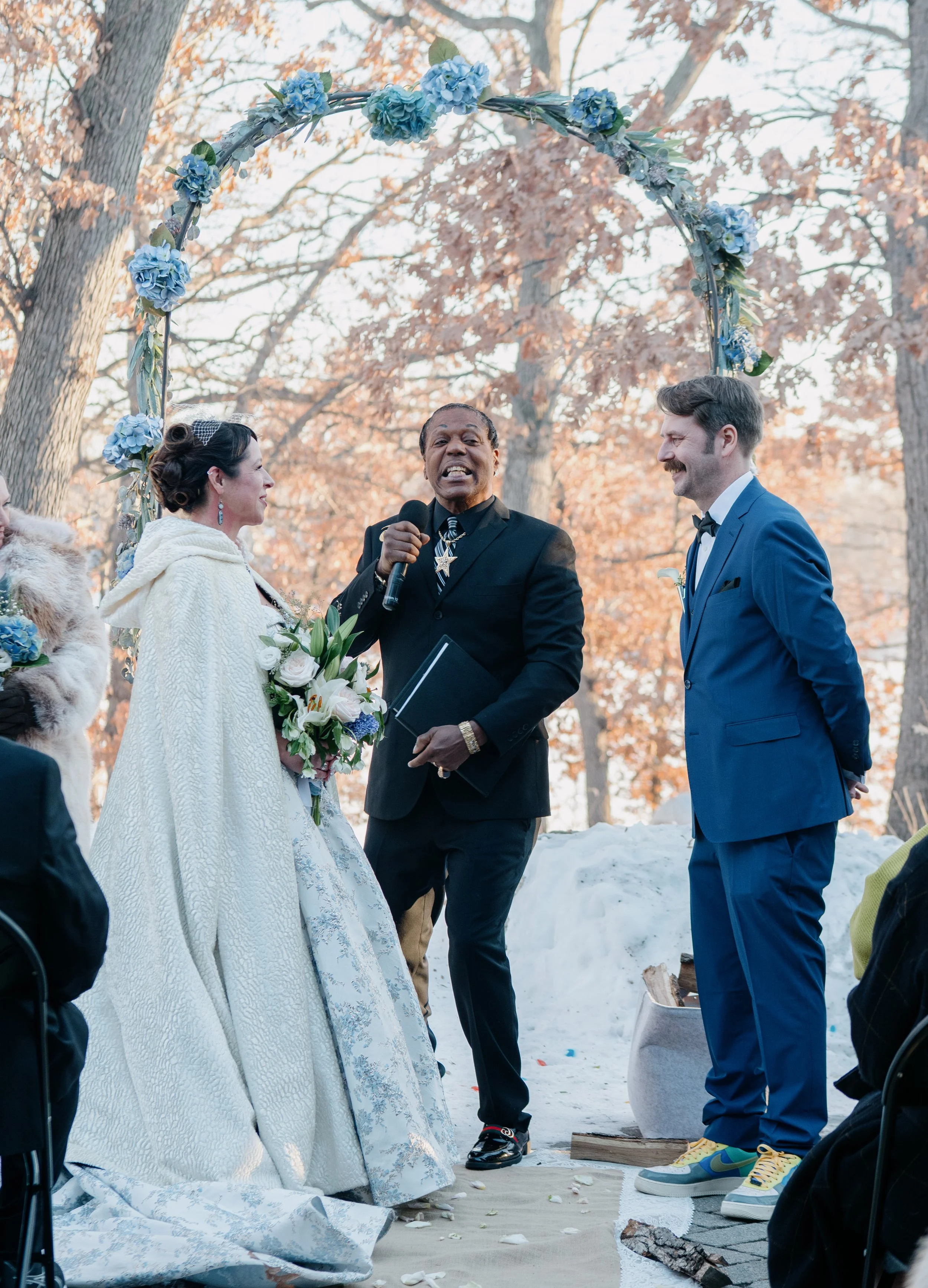 Outdoor winter wedding ceremony overlooking Silverwood Lake in Minneapolis, Minnesota — Madeline H Nelson Photography
