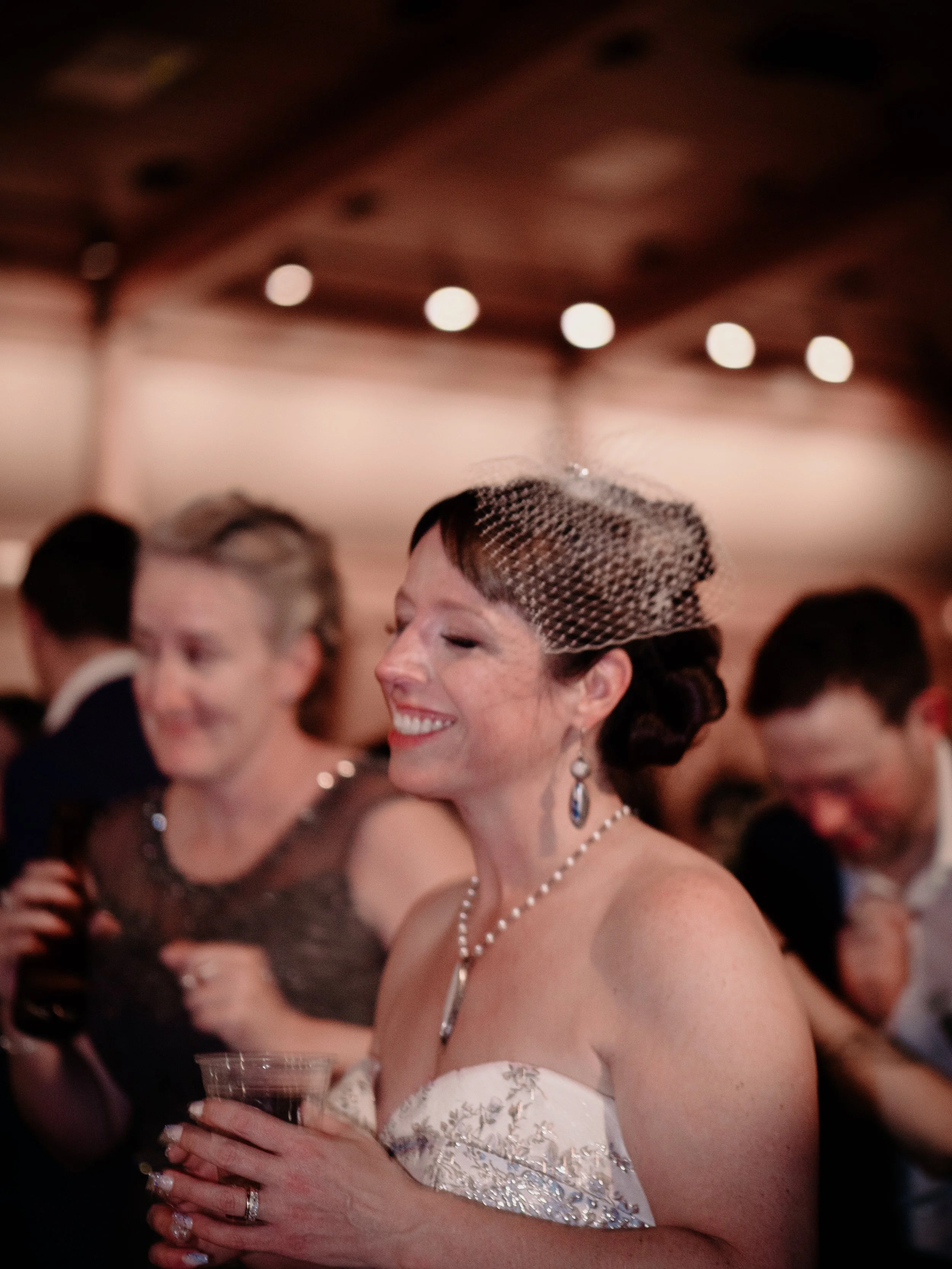 End-of-night candid moment from Hamil and Vanessa's winter wedding at Silverwood Park, Minneapolis — photography by Madeline H Nelson