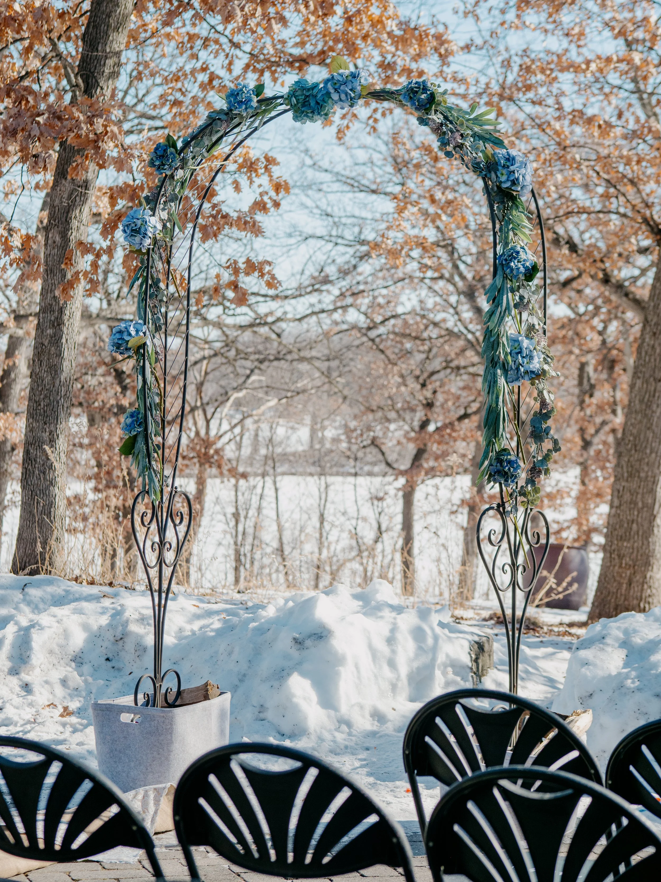 The patio at Silverwood Park. Blue cast on the snow contrasted by remnants of autumn's orange brown leaves. Its the beauty of the contrast for me.