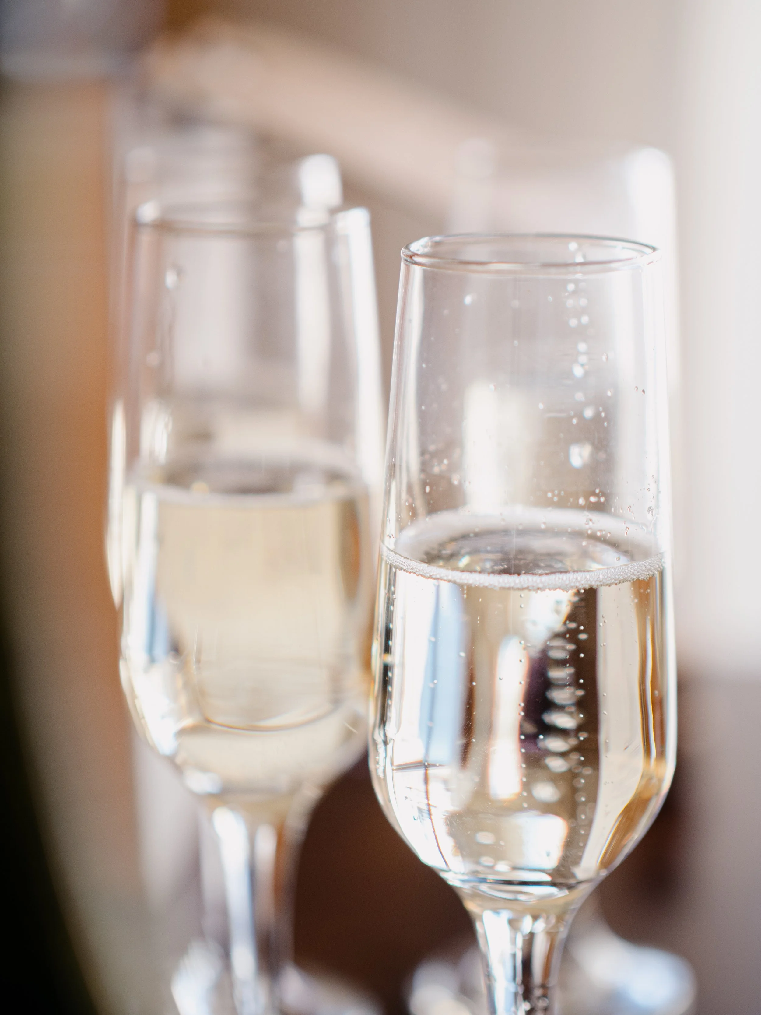 Champagne glasses with soft light  — Minneapolis wedding photography by Madeline H Nelson