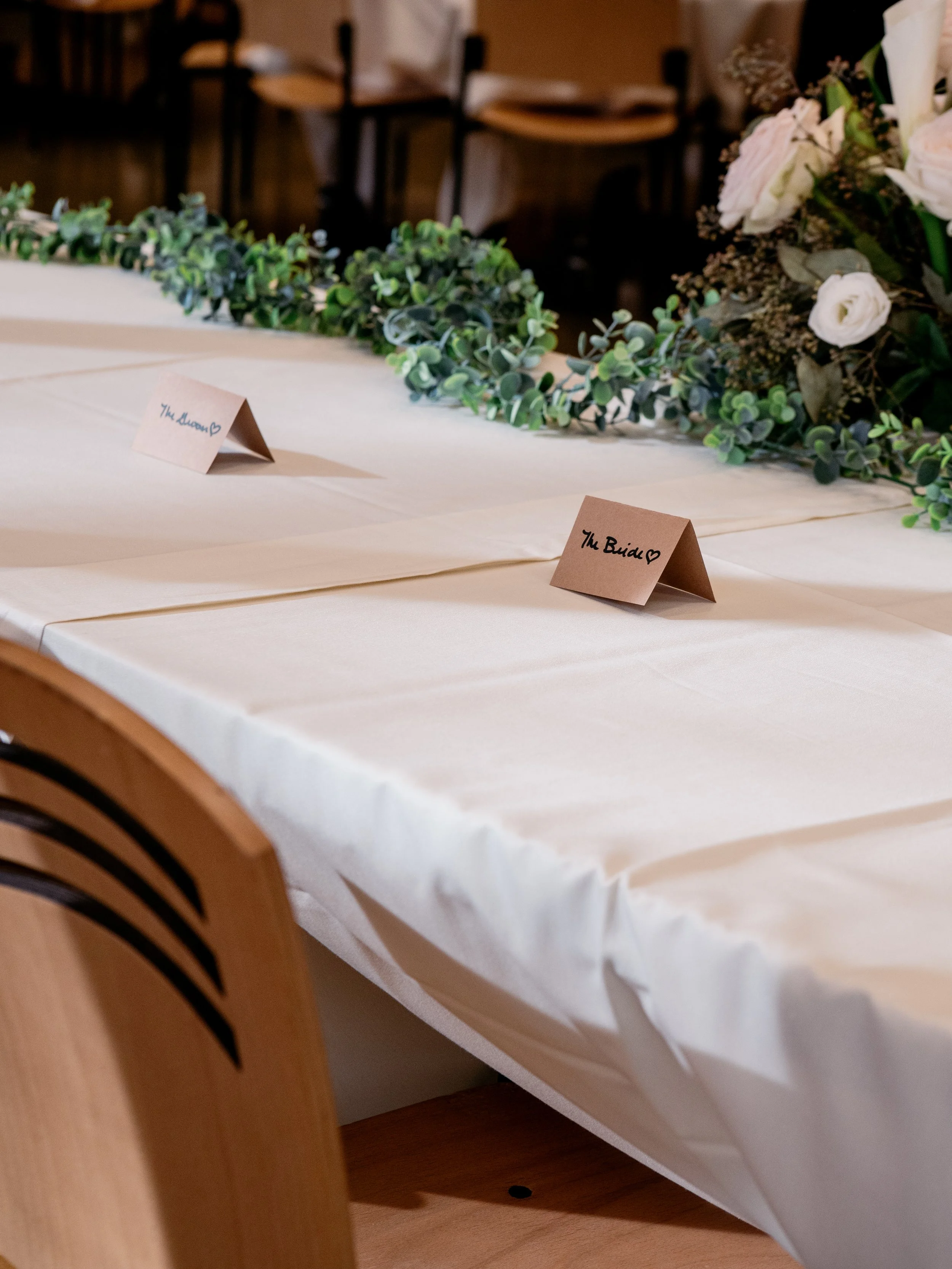 Wedding reception detail at Silverwood Park — elegant table settings and classic florals from Hamil and Vanessa's winter wedding in Minneapolis