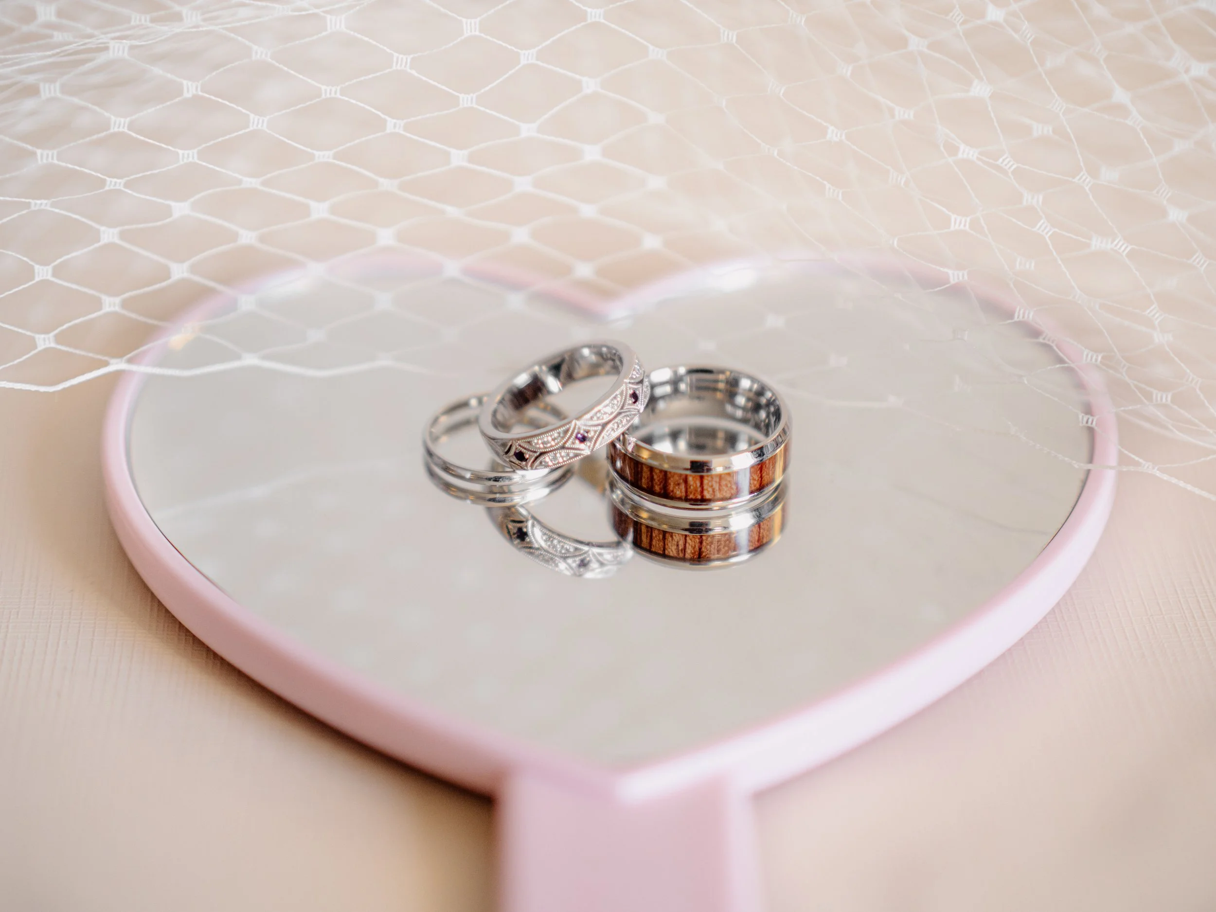 Close-up wedding detail photo of the wedding rings from Hamil and Vanessa's classic winter wedding at Silverwood Park, Minneapolis, Minnesota
