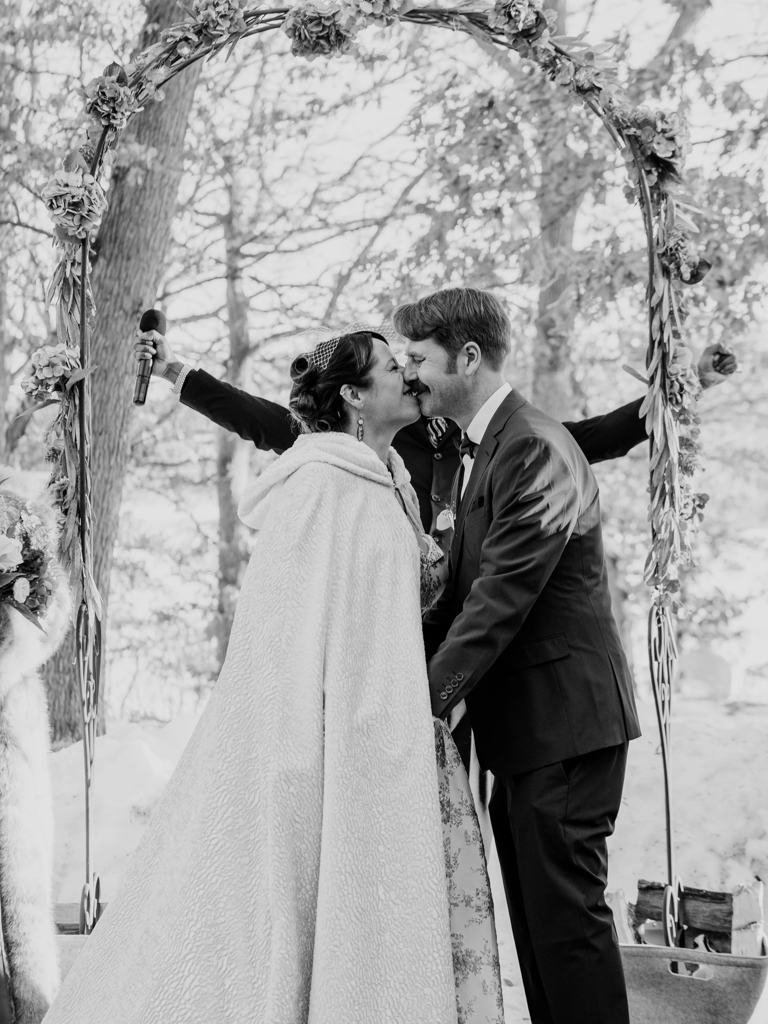 Newlyweds Hamil and Vanessa sharing a first kiss at their outdoor winter ceremony at Silverwood Park, Minneapolis, Minnesota