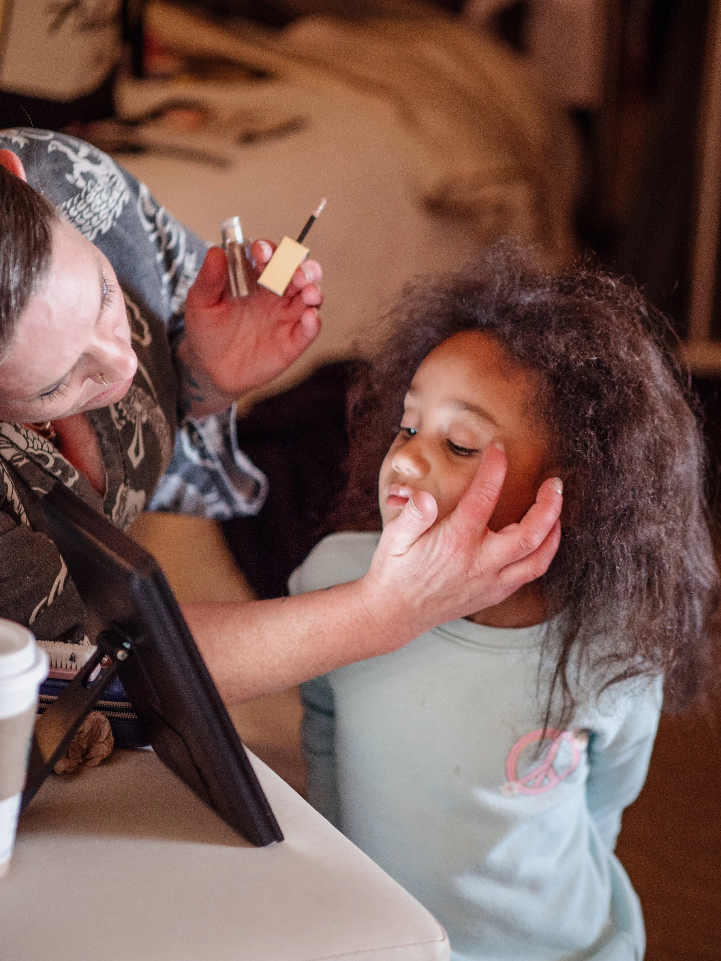 Flowergirl getting makeup done — Minneapolis wedding photography by Madeline H Nelson