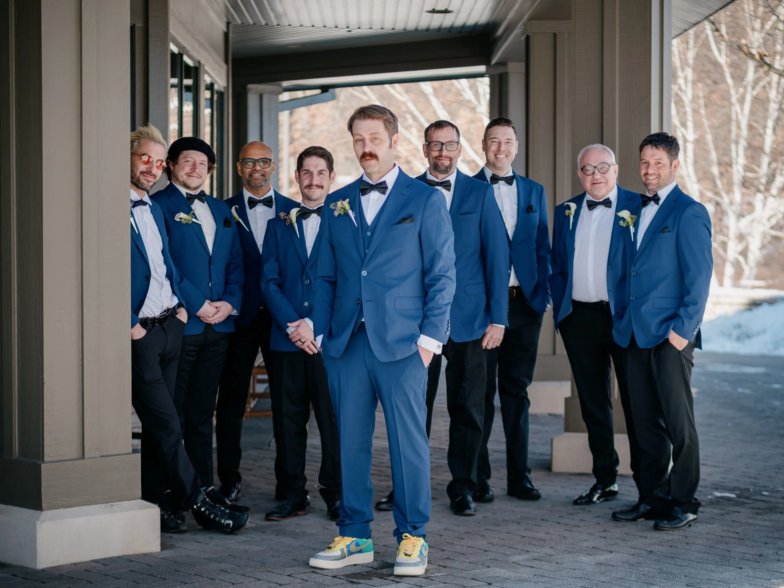 Groomsmen portrait at Hamil and Vanessa's formal winter wedding at Silverwood Park in Minneapolis — candid group wedding photography
