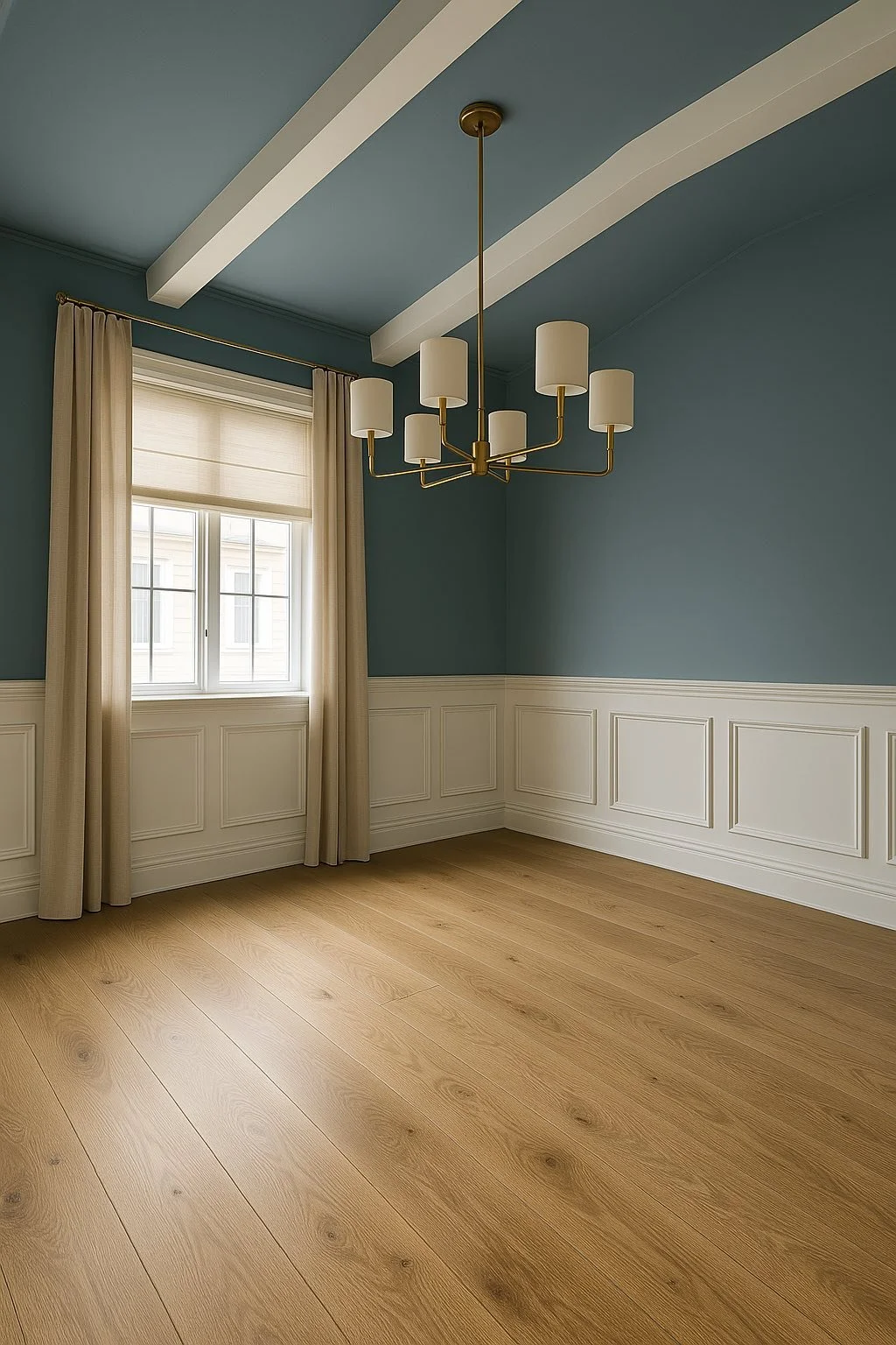 Empty room with blue walls, white wainscoting, cream curtains, wooden floor, and modern chandelier. Camp Renovation and Design in Columbus, Ohio.
