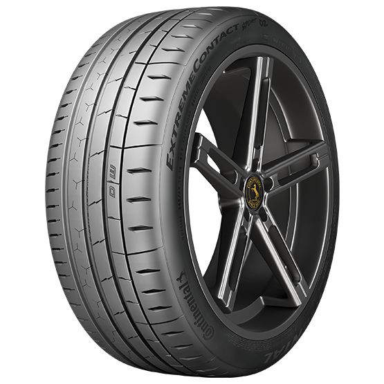 A car tire with a black rim and a yellow emblem at the center, marked 'EXTREME CONTACT' and '4D' on the sidewall.
