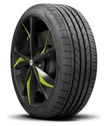 Close-up of a black car tire with a modern rim featuring black and green accents.
