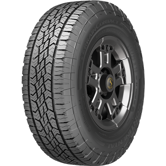 A black off-road tire with a rugged tread pattern mounted on a black alloy wheel with a central hubcap.