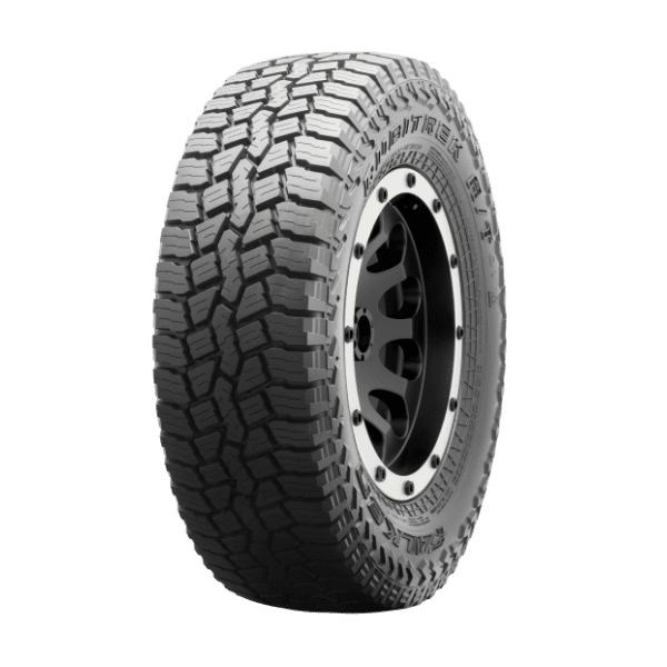 Off-road tire with rugged tread pattern mounted on a black rim