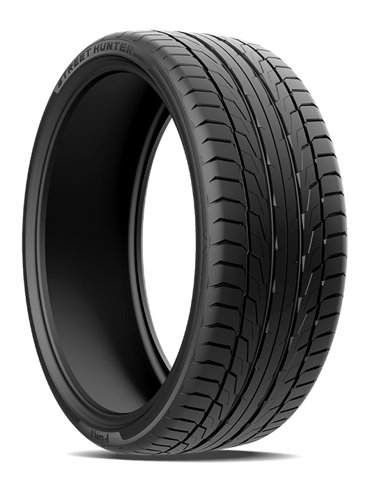 A black car tire with detailed tread pattern