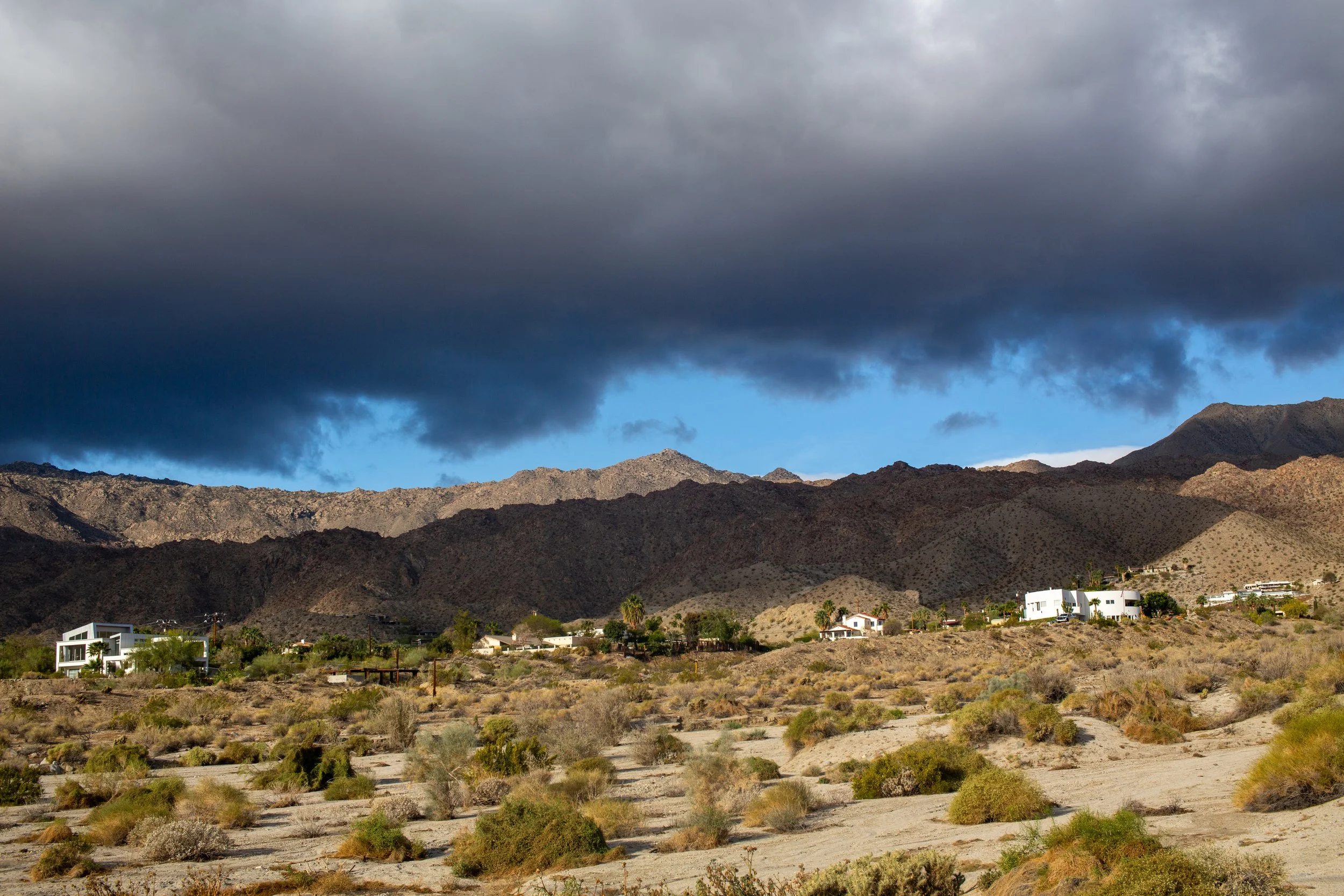 Stormy clouds cast  shadows across the mountains in Cahuilla Hills