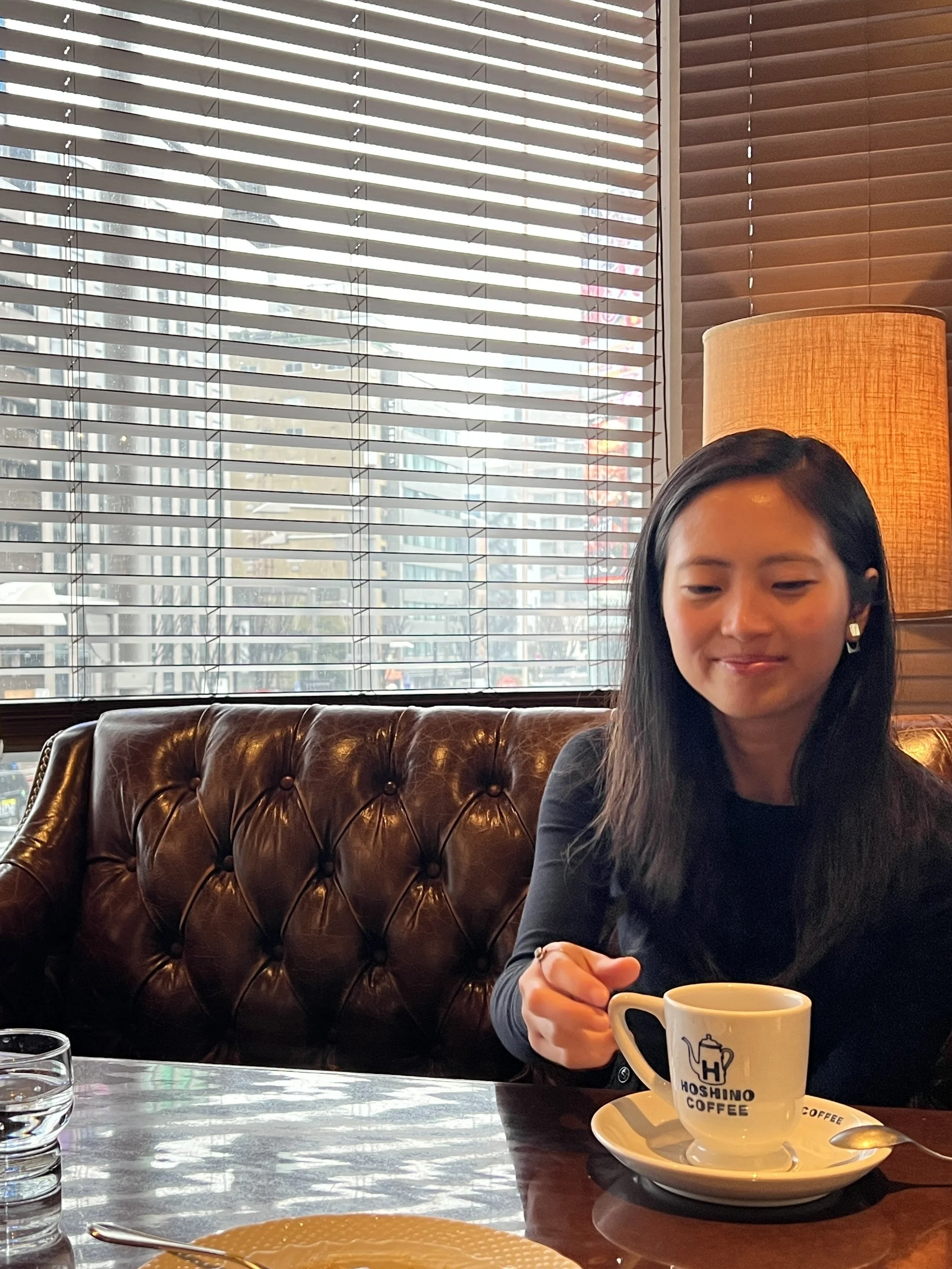 Image of the writer in a cafe in Tokyo.