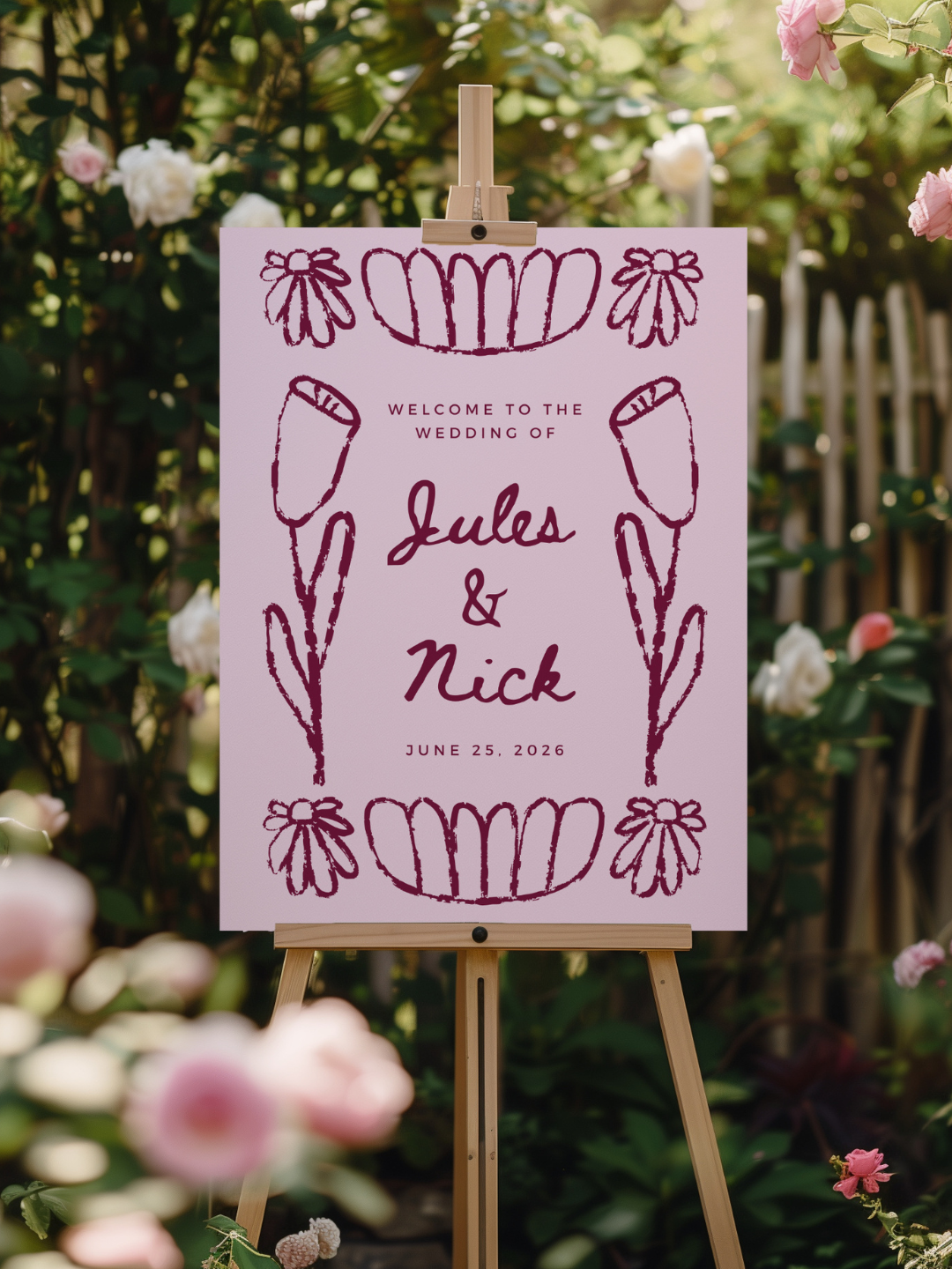 Wedding welcome sign with floral illustrations and the names Jules and Nick, dated June 25, 2026, displayed outdoors surrounded by flowers and greenery.