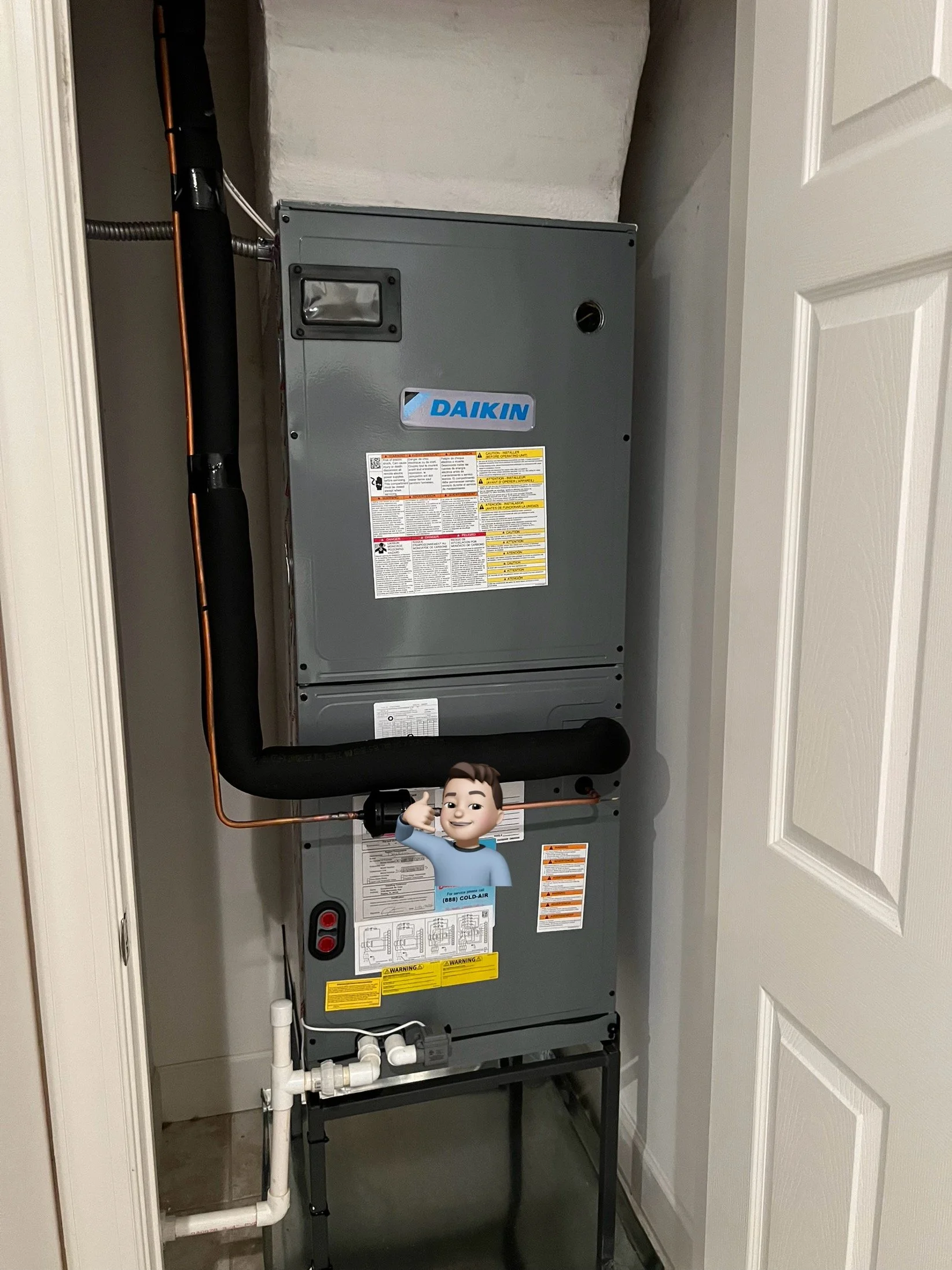 A Daikin HVAC unit installed in a closet with white walls and a white door partially open.