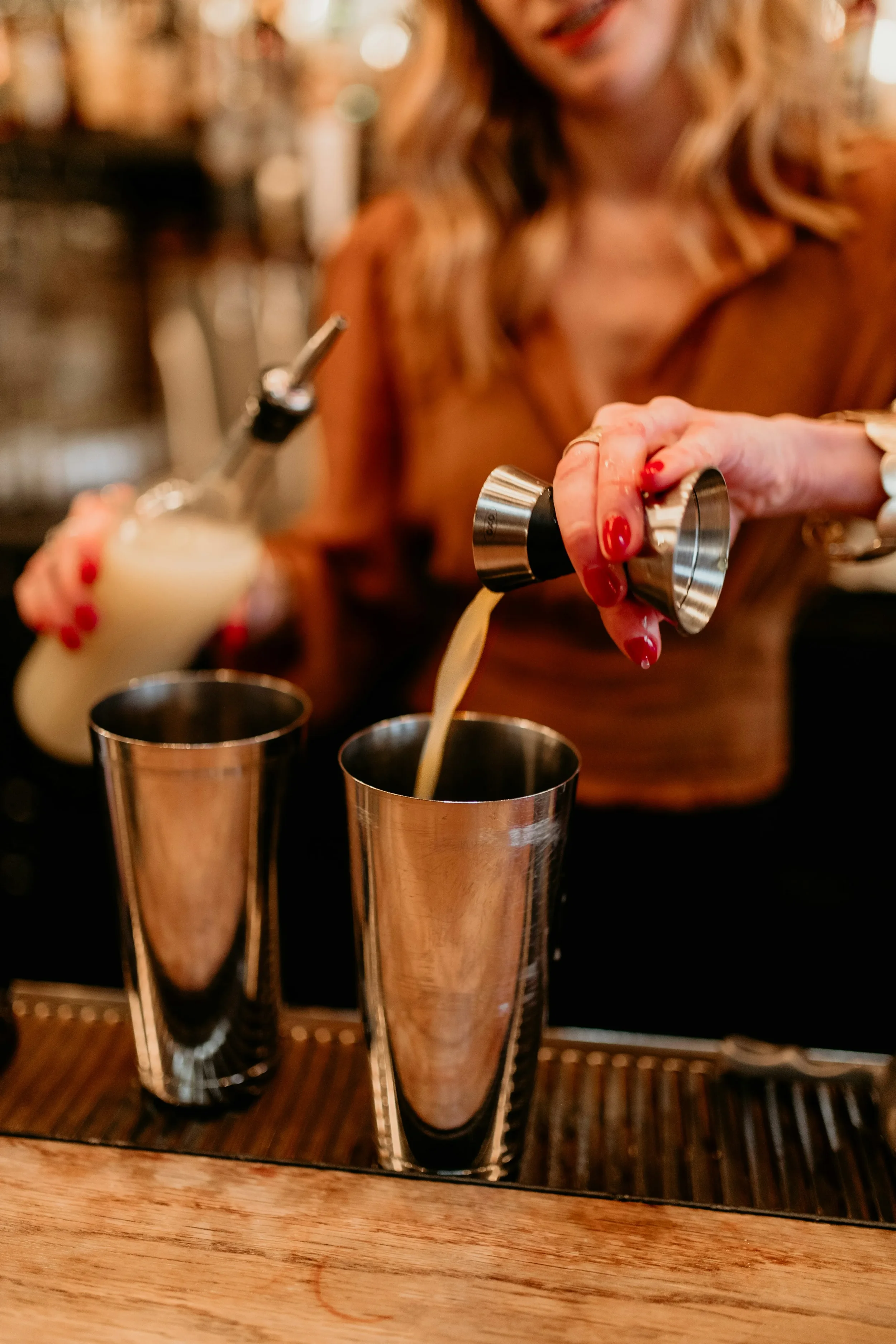 Bartender pouring a cocktail at an Australian pub or club venue