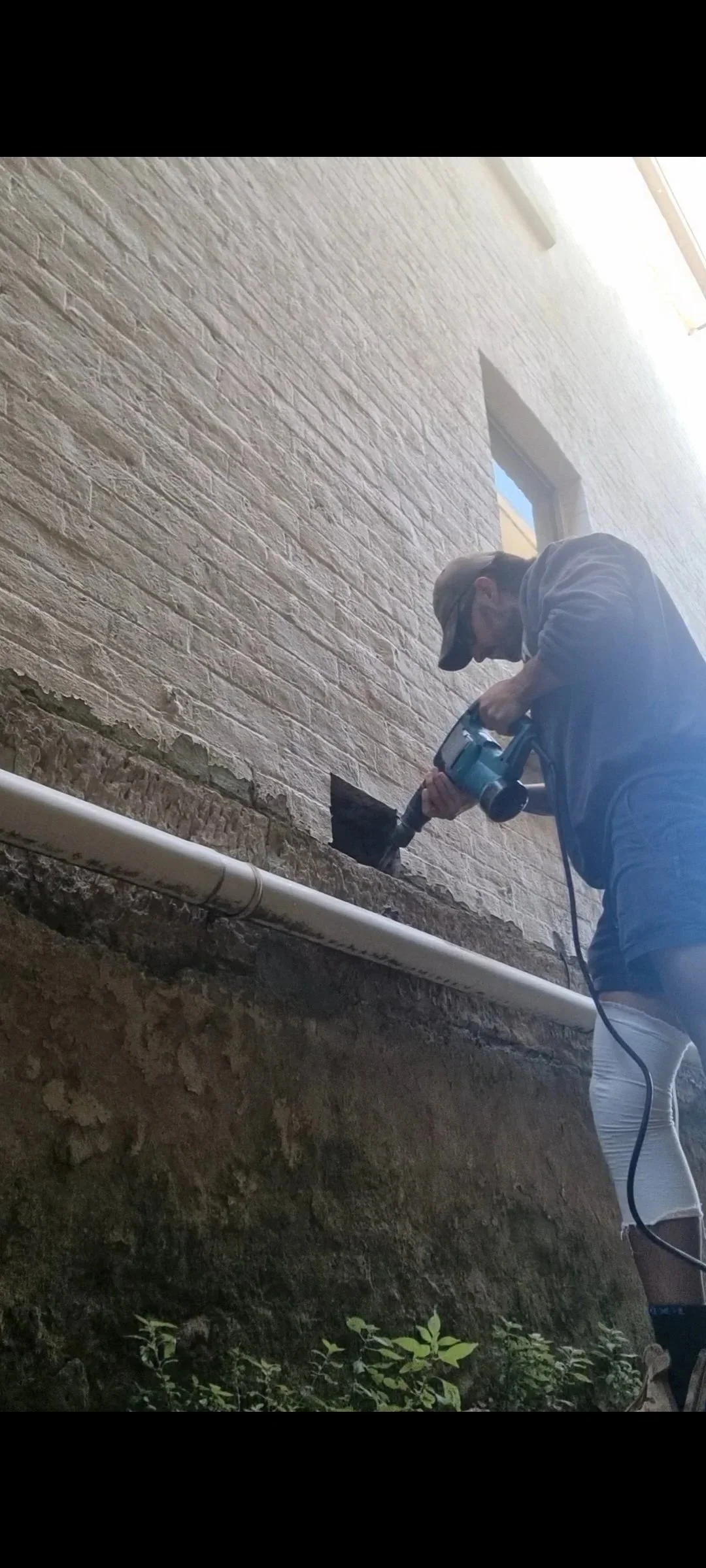 External subfloor ventilation vent installed on brick wall