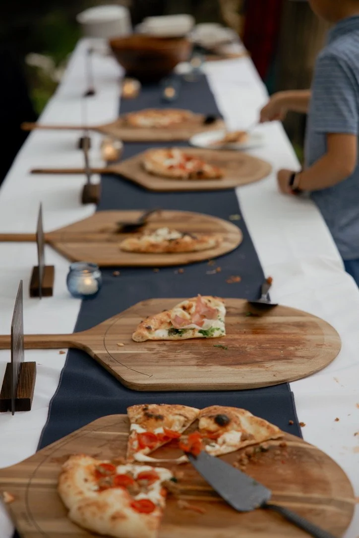 Pizza boards on the serving table