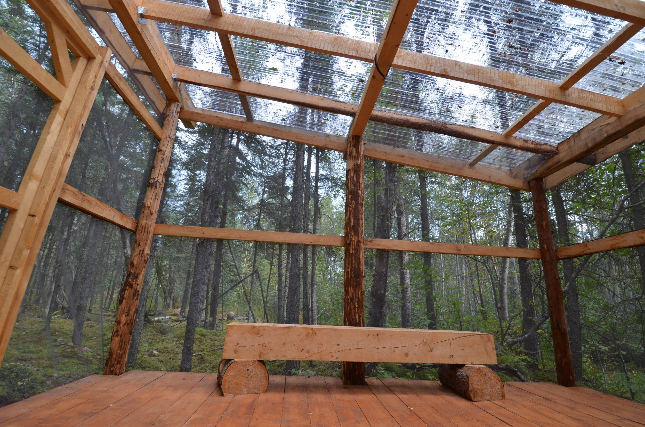 Port Alsworth Campground huts have a clear poly roof, mosquito screened walls and solid wood floor.