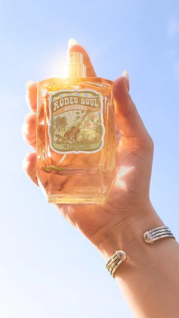 04-jessie-roeker-tru-western-rodeo-soul-harmony-bottle-in-hand-against-blue-sky-9x16.jpg