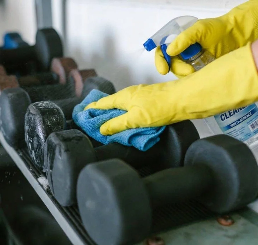person gleaning gym weights