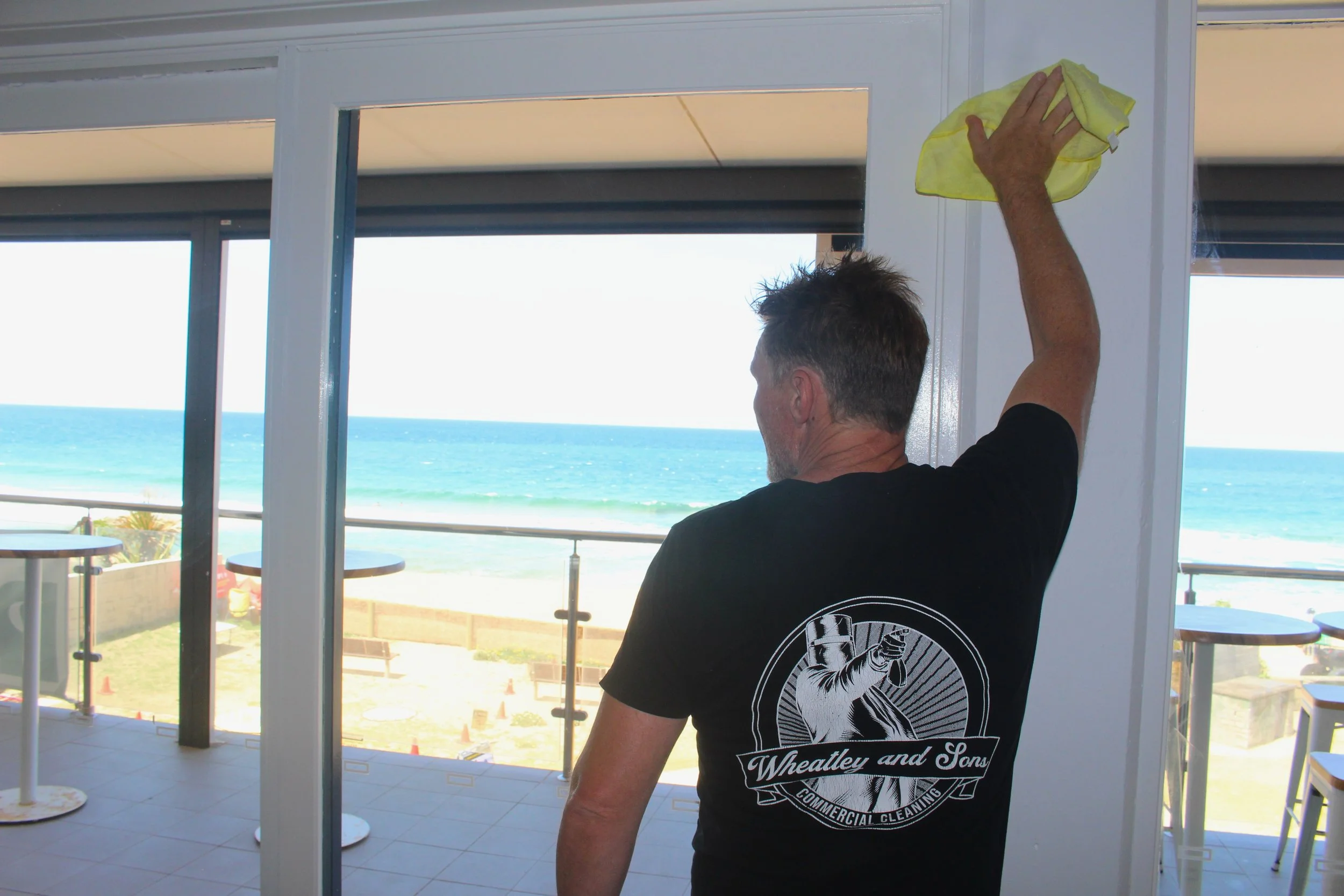 Wheatley and sons team cleaning windows