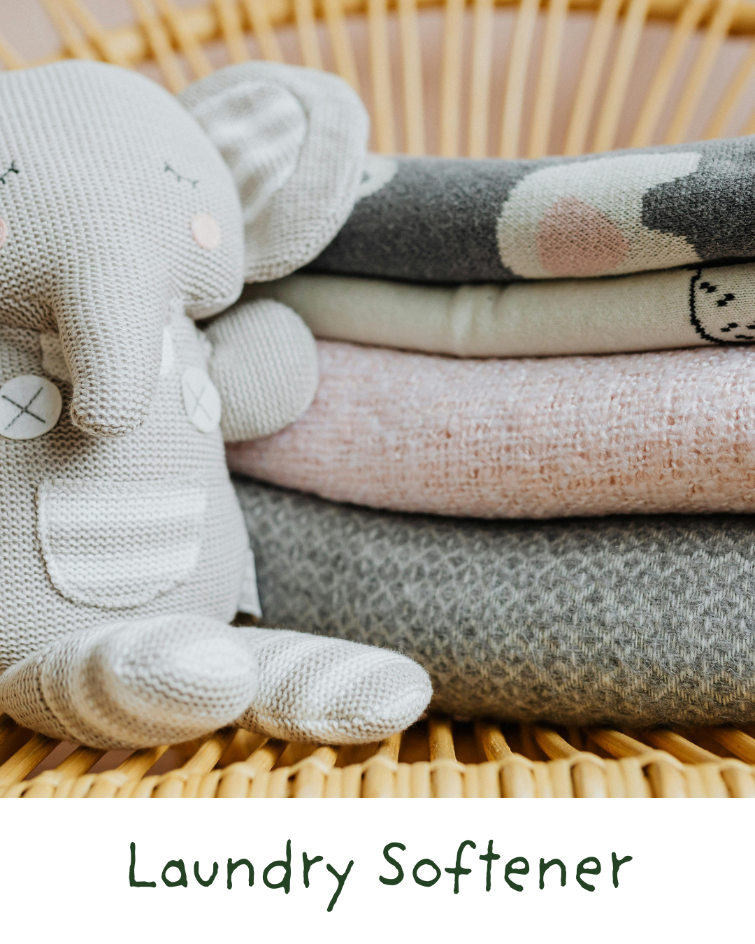 Stacked folded laundry with a soft toy bunny nearby, placed on a rattan laundry basket, labeled 'Laundry Softener'.