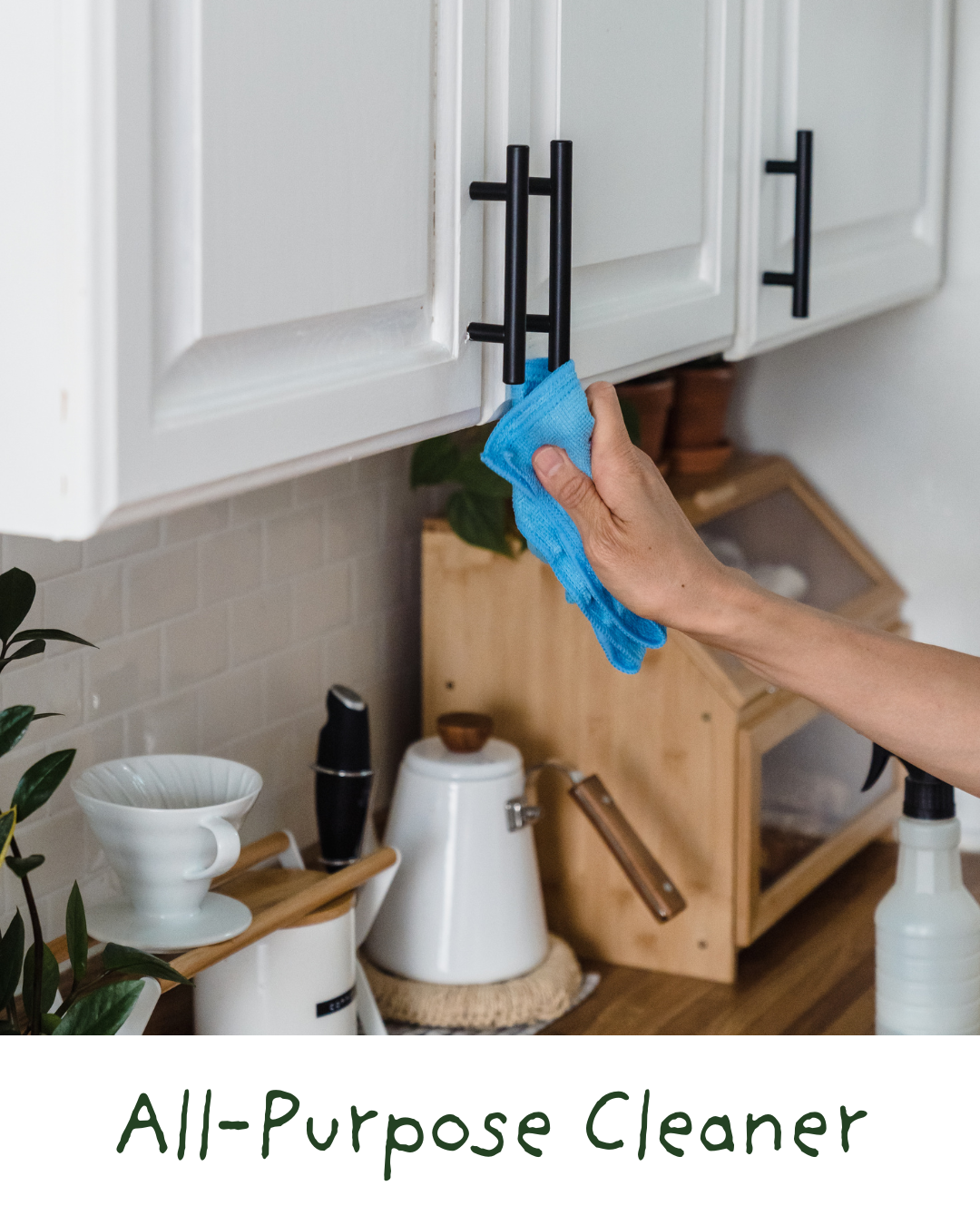 Person cleaning cabinet handle with a blue cloth, kitchen setting with tools and decor items.