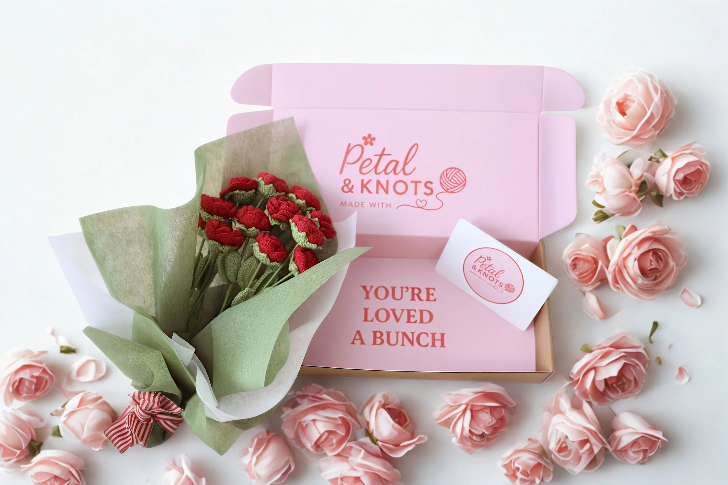 Dozen Red Roses with a rose theme backdrop.jpg