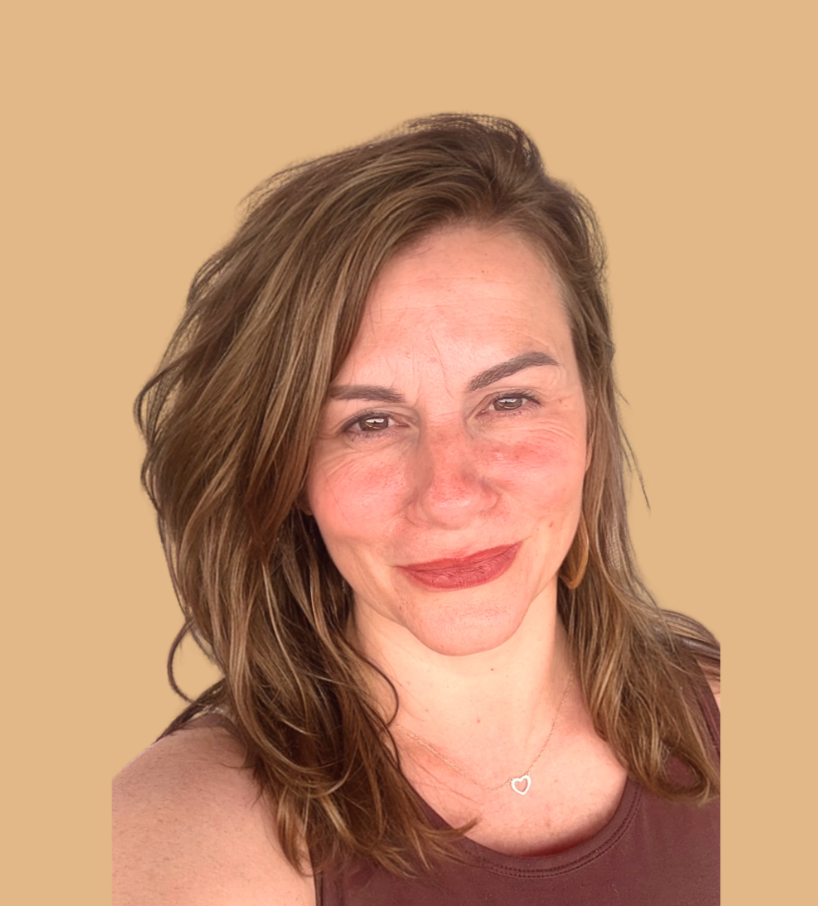 A woman with wavy, shoulder-length light brown hair wearing a sleeveless brown top, smiling softly, against a beige background.