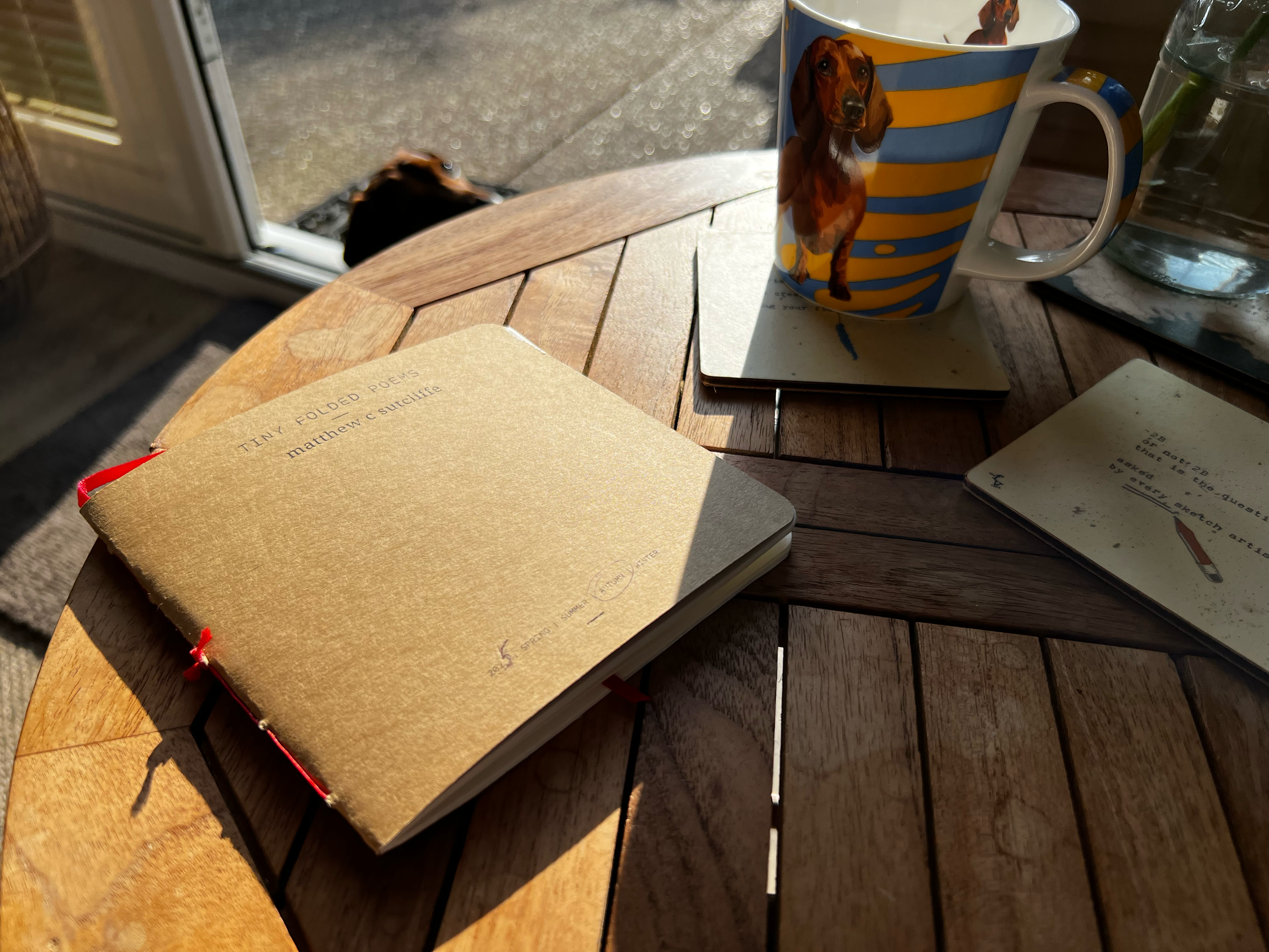 Table + Ziggy + mug + sunshine + coasters.png
