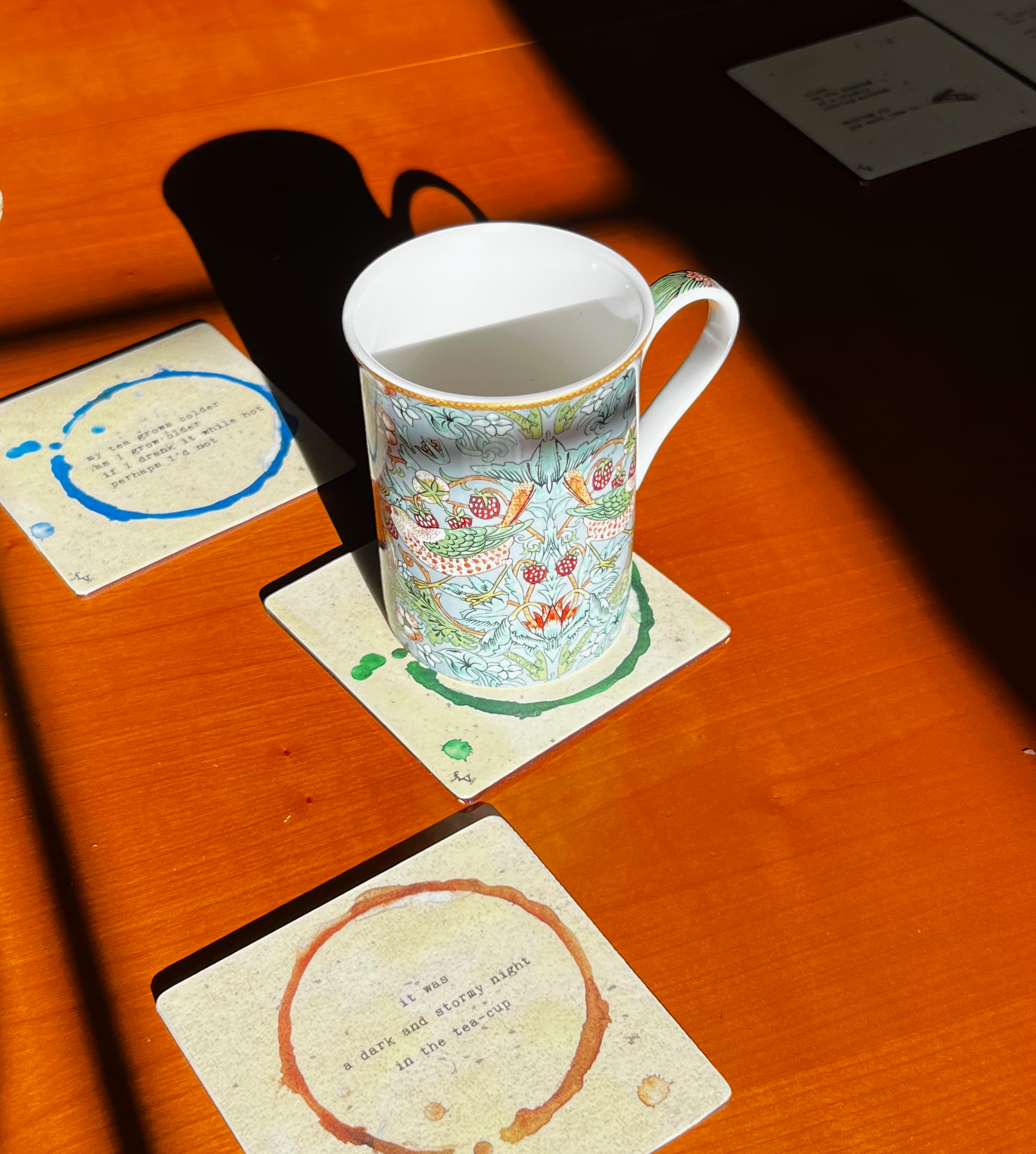 Ring Marks duo on table w:Morris mug.png