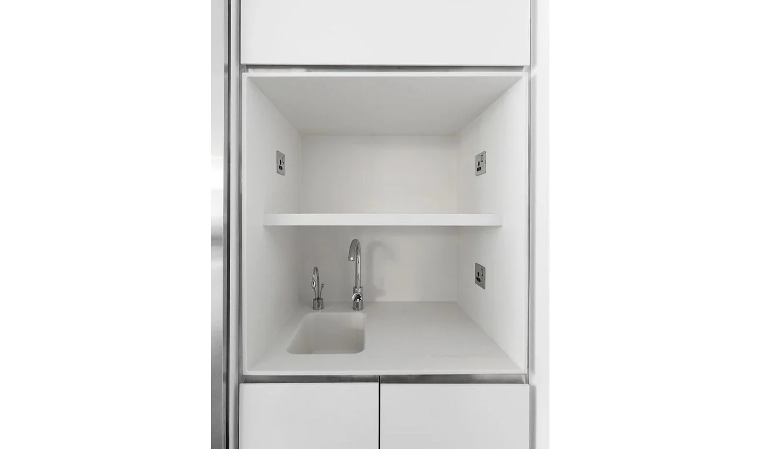 BBO office pantry by Wan Fang Construction showing sleek design and clean lines; minimal ambiance in Hong Kong Central.