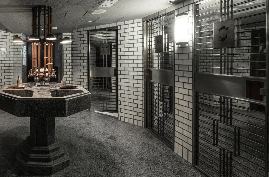 Mott 32, an award-winning Chinese Restaurant, washroom area by Wang Fang Construction, modern and rustic decor with white bricks and metal as key elements in Hong Kong Central. 