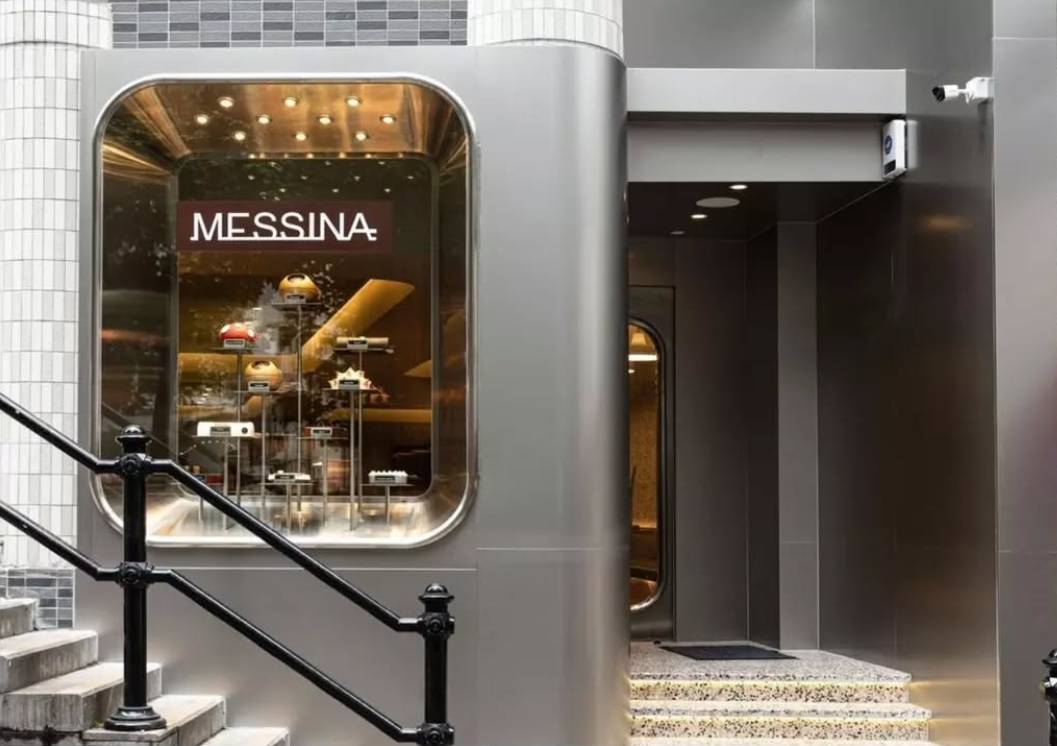 Messina Pattiserie Storefront window display with the sign 'Messina' by Wan Fang Construction, featuring variety of high-end desserts and cakes, in Hong Kong Central.