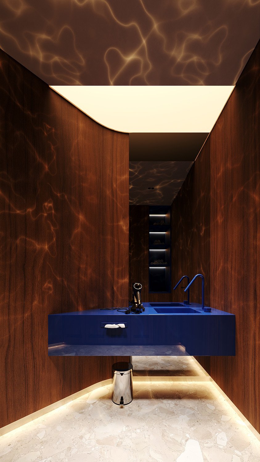 Luxury spa changing room at FŌM Hygge Spa, City Walk Dubai, designed by Limestone, with an electric blue floating vanity, lacquered wood walls and water-ripple lighting