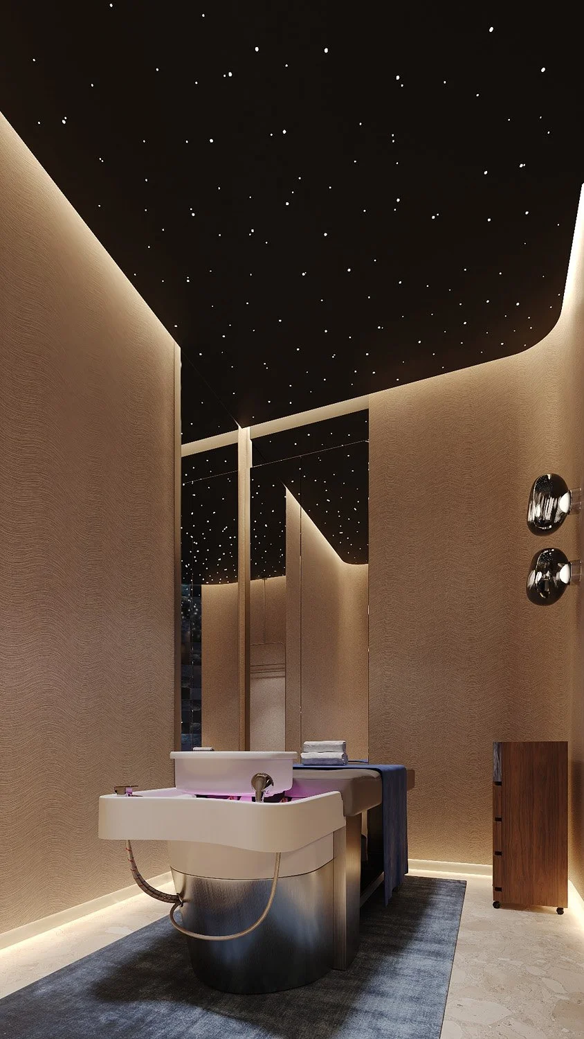 Head spa room at FŌM Hygge Spa, City Walk Dubai, designed by Limestone, with wave-textured wallcovering, a fibre-optic starry ceiling and a mirrored wall