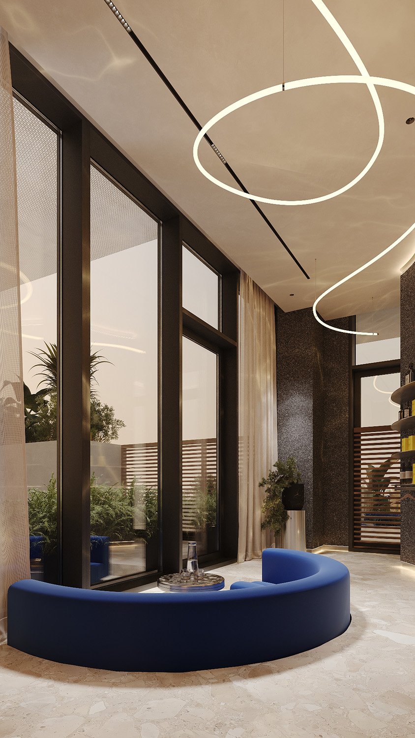 Commercial spa interior by Limestone at FŌM Hygge Spa, City Walk Dubai, with an electric blue velvet sunken lounge facing the terrace through floor-to-ceiling windows