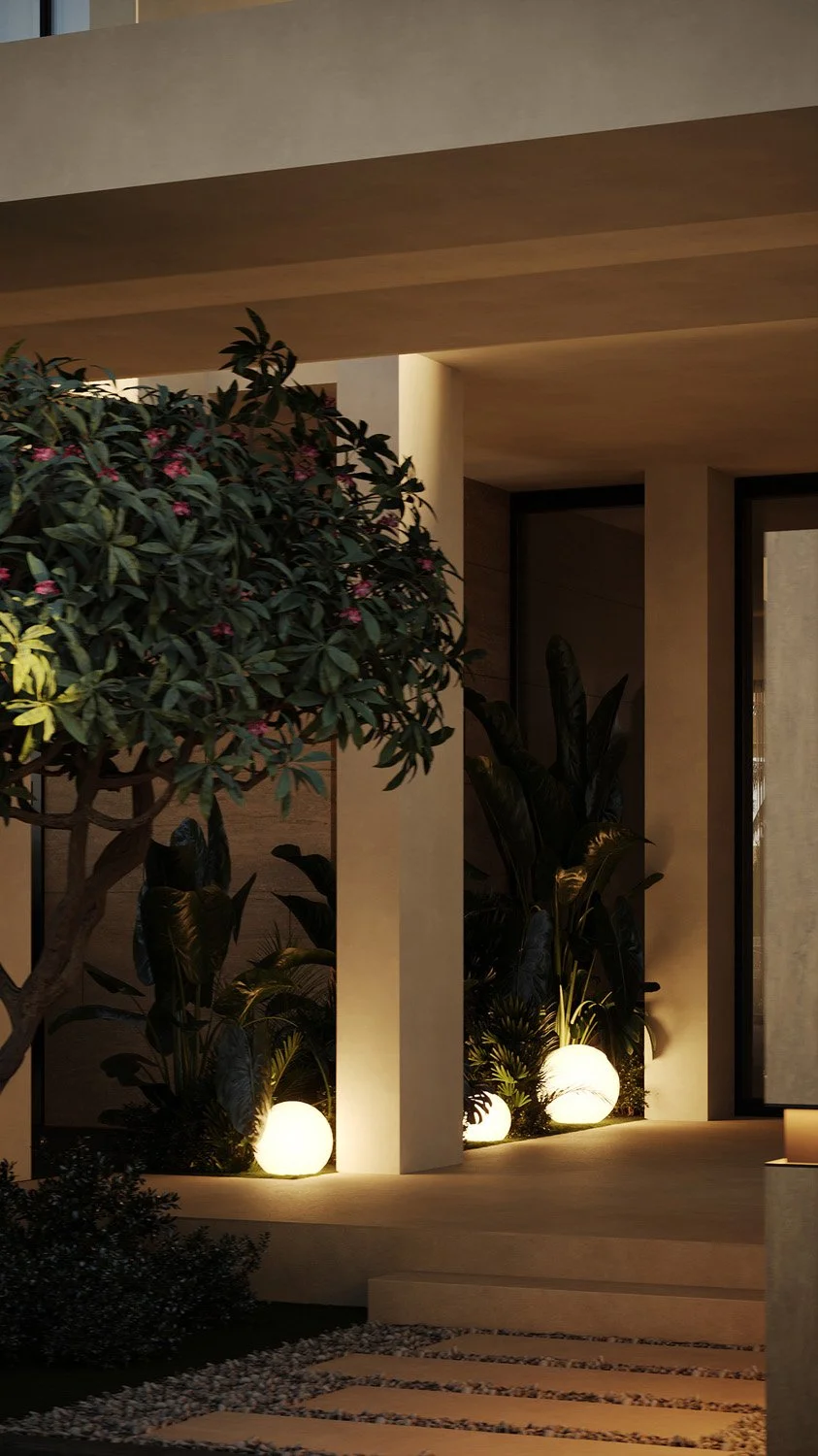 Entrance detail of a Dubai Hills villa landscape, with a lush tropical planter, layered foliage, and warm orb-style landscape lighting by Limestone