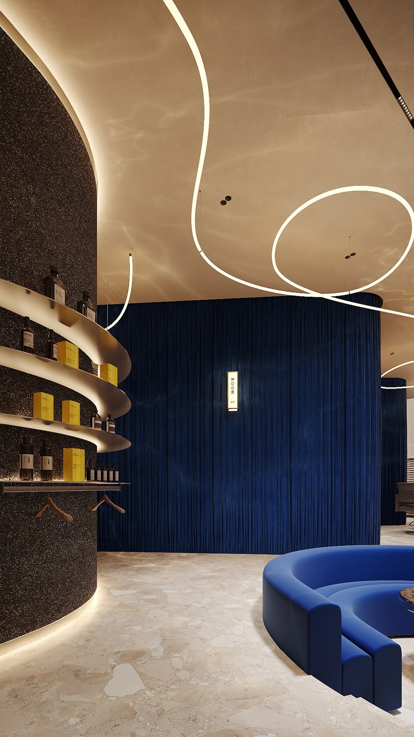 Luxury spa reception at FŌM Hygge Spa, City Walk Dubai, designed by Limestone, with a curved resin crushed stone retail wall, pleated electric blue velvet and sculptural linear lighting