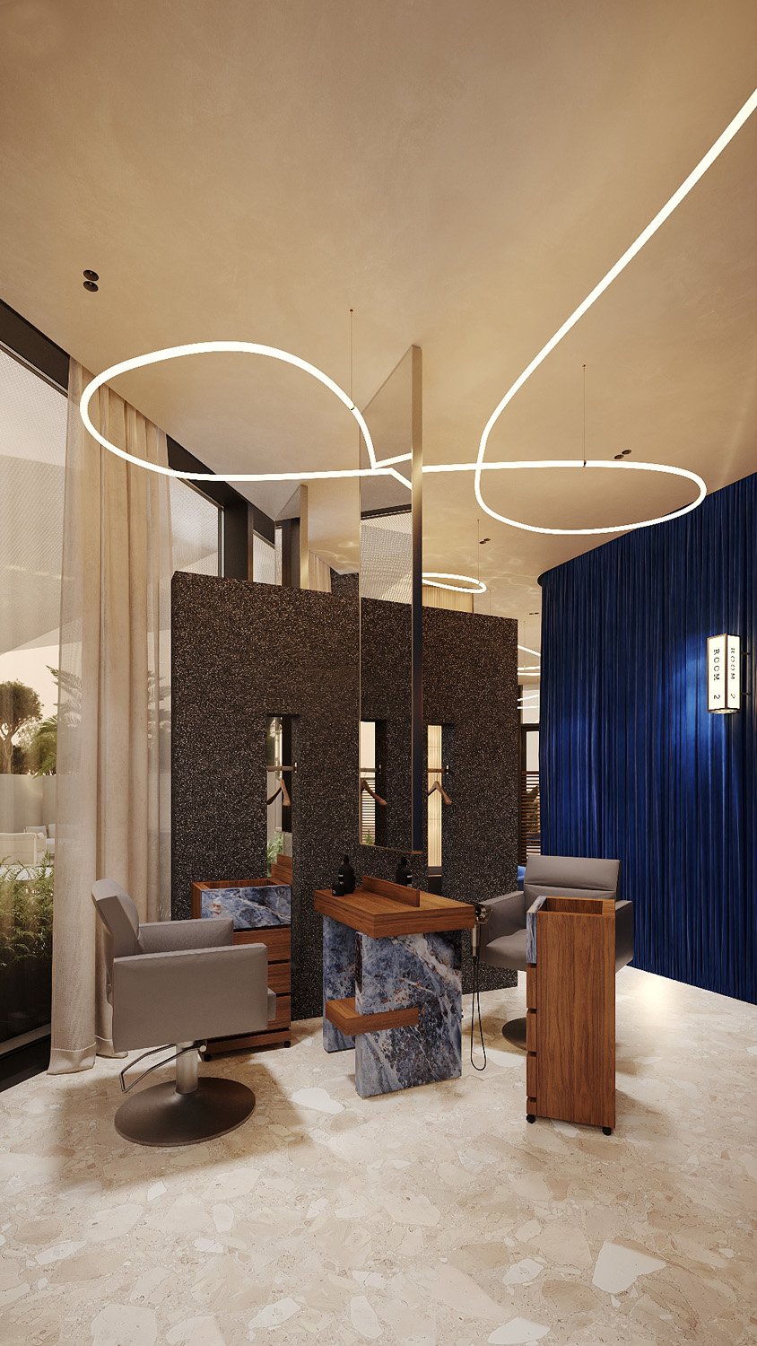 Luxury salon at FŌM Hygge Spa, City Walk Dubai, designed by Limestone, with blue stone and wood styling consoles, pleated blue velvet walls and sheer curtains