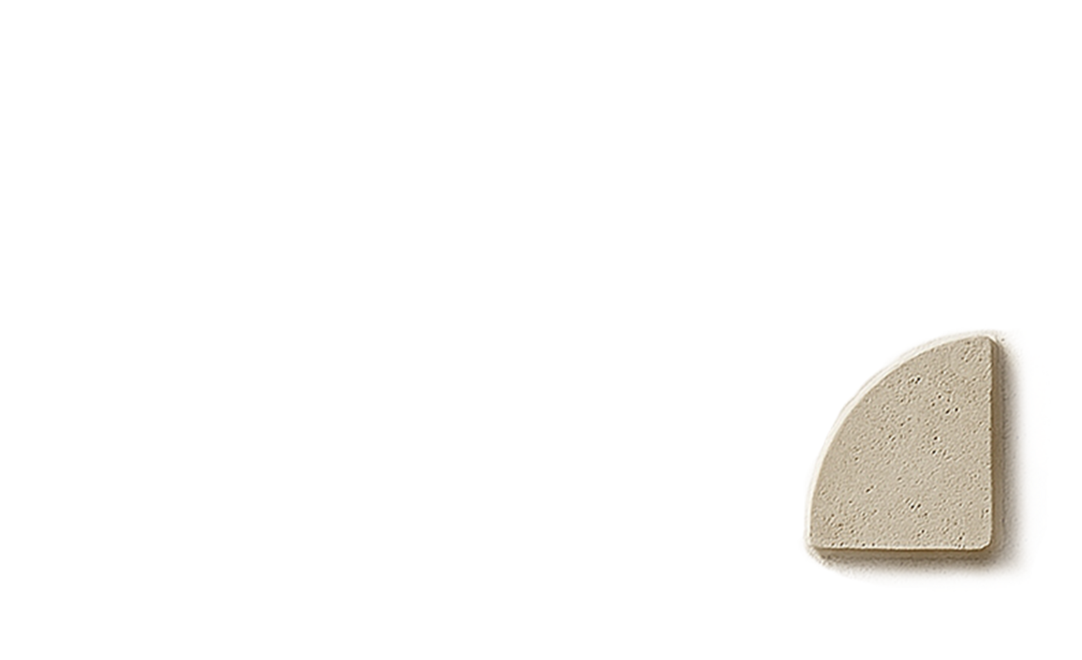 A blackboard with science or math equations written on it and a white chalk. In the foreground, there is a beige clay or plaster object resembling a sliced cake or pie chart with a textured surface.