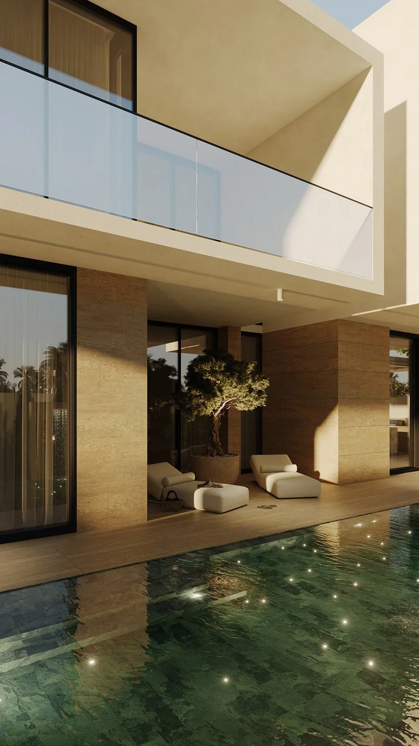 Pool deck lounge area in a Dubai Hills villa landscape, with cream chaise loungers, a potted olive tree, and the Sukabumi green tile pool, designed by Limestone